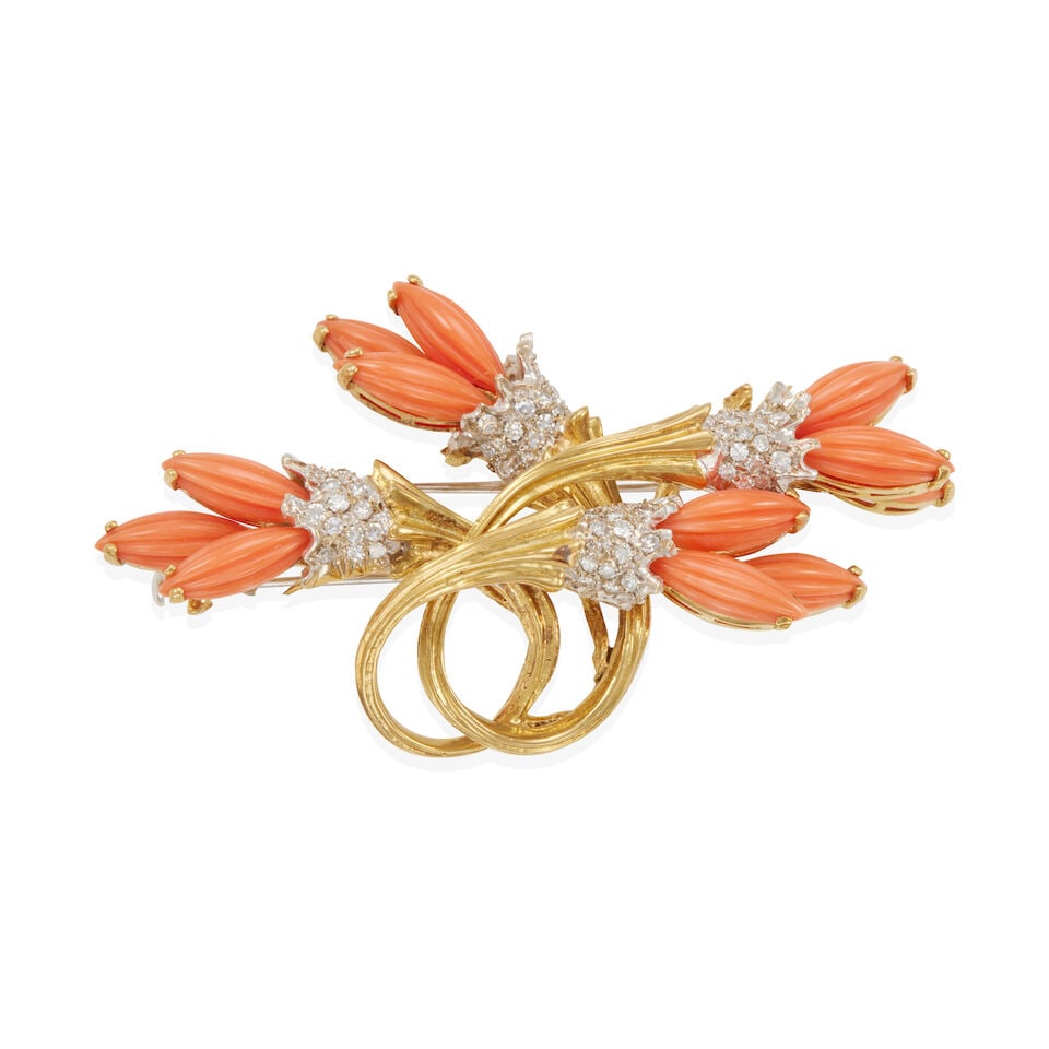 18K BICOLOR GOLD, CORAL, AND DIAMOND FREE-FORM BROOCH: 18K BICOLOR GOLD, CORAL, AND DIAMOND FREE-FORM BROOCH • 18k yellow and white gold • 12 carved cabochon corals, measuring approximately 13.00 x 4.60 x 2.90 mm each • 72 round