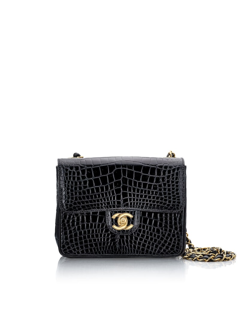 CHANEL: VINTAGE BLACK CROCODILE MINI FLAP WITH GOLD TONED HARDWARE (Includes authenticity card a...: CHANEL: VINTAGE BLACK CROCODILE MINI FLAP WITH GOLD TONED HARDWARE Circa 1996-1997 香奈兒：復古黑色鱷魚皮迷你翻œ