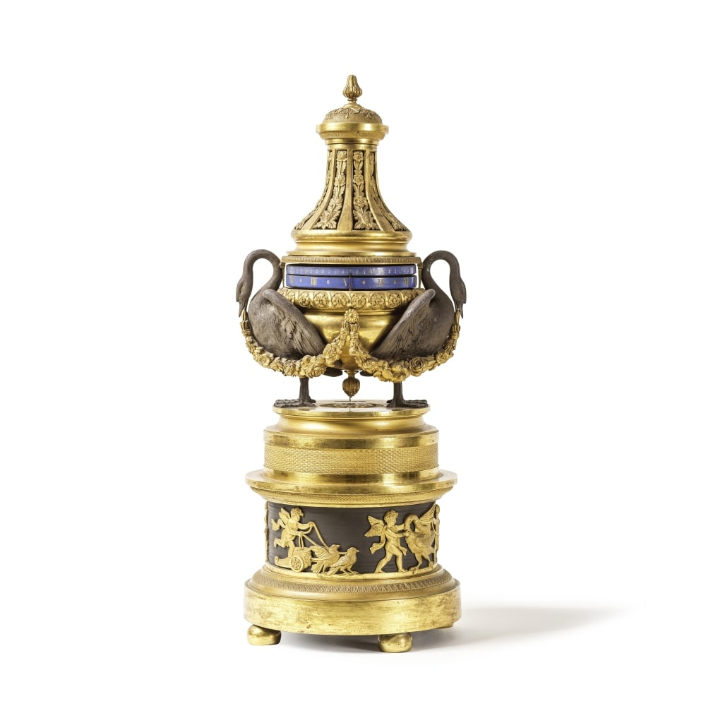 Pendule à cadran circulaire tournant en bronze doré et à patine brune du déb... (1 of 1)