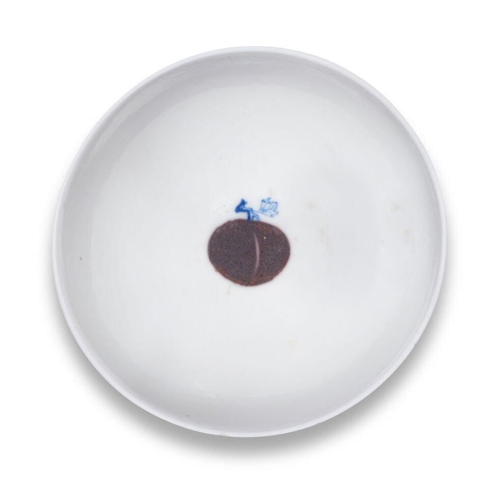 A BLUE AND WHITE AND UNDERGLAZE-RED 'PEACH' BOWL Xuande six-character mark, Kangxi: A BLUE AND WHITE AND UNDERGLAZE-RED 'PEACH' BOWL Xuande six-character mark, Kangxi Elegantly potted with gently rounded sides rising from a slightly incurving foot, painted to the centre of the interi