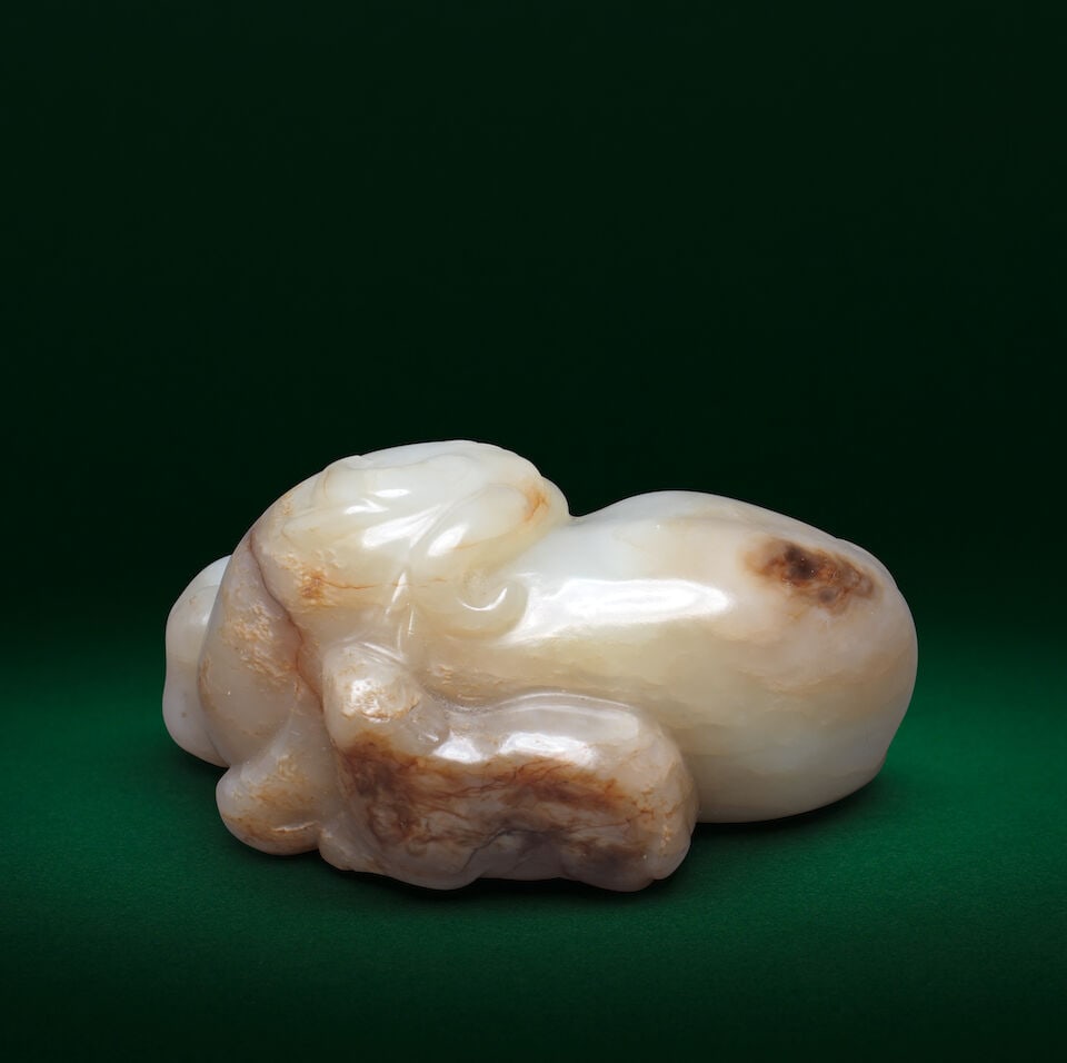 A PALE GREEN AND RUSSET JADE CARVING OF THREE RAMS 'SANYANG' Ming Dynasty - 2