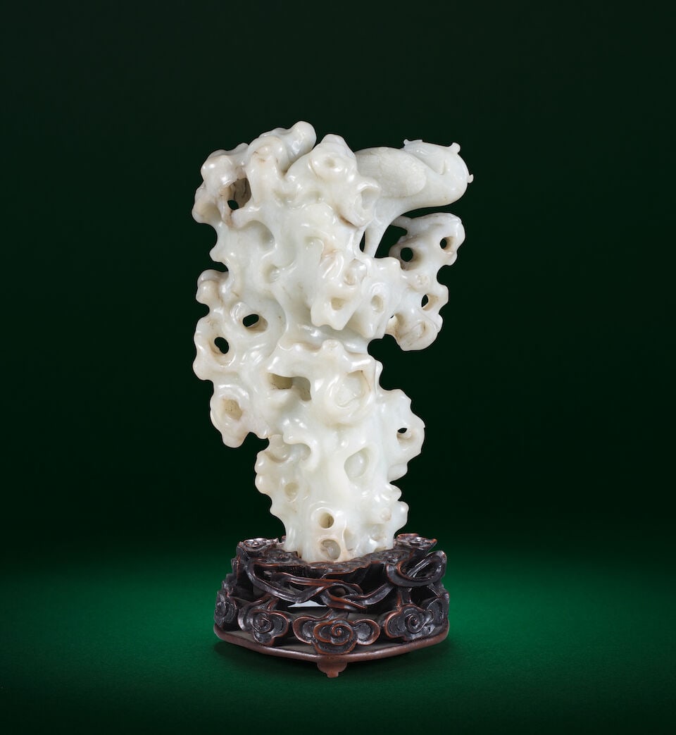 A WHITE JADE 'PHOENIX ON ROCKWORK' RETICULATED GROUP 18th century - 2