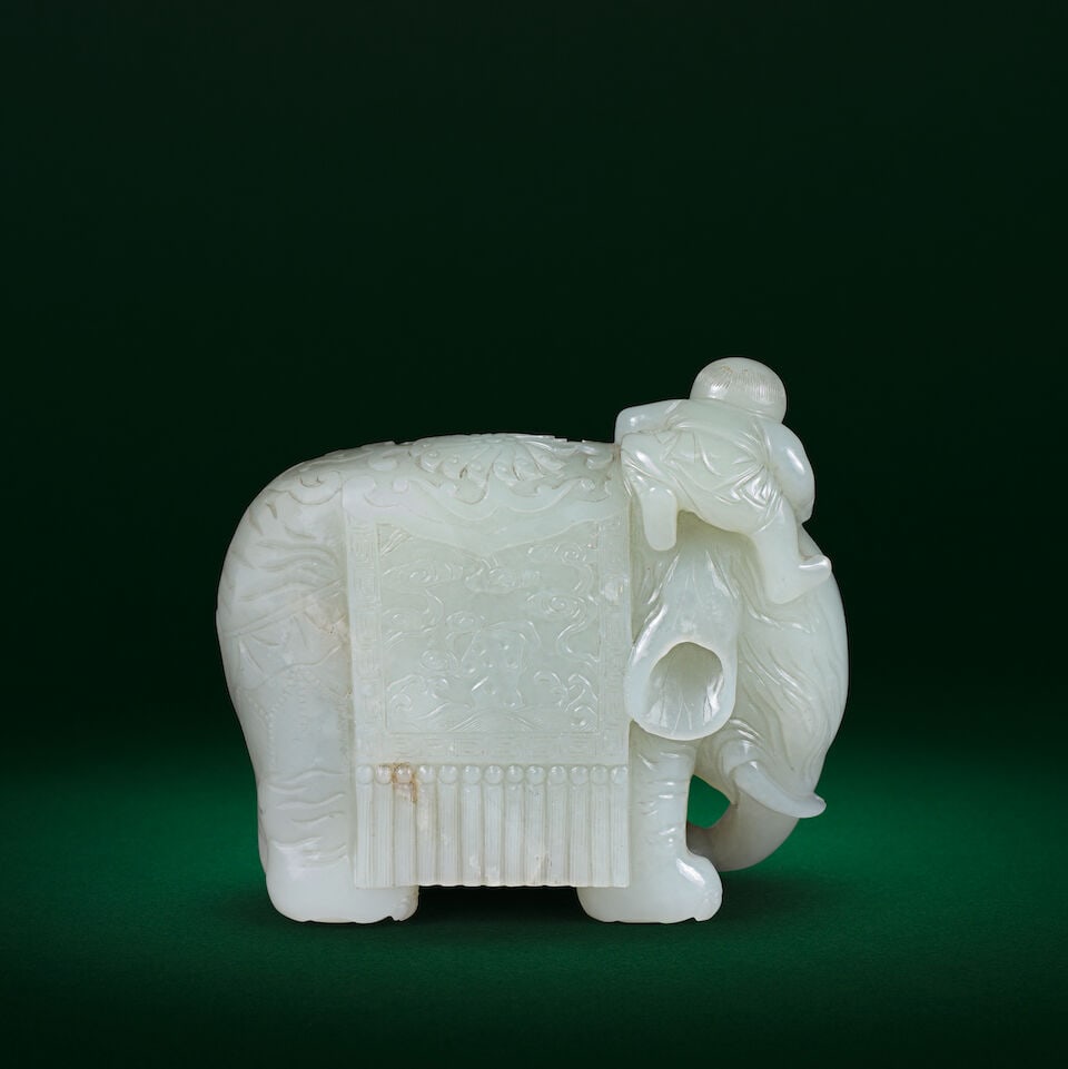 A WHITE-PALE GREEN JADE CARVING OF AN ELEPHANT AND BOY Qianlong/Jiaqing - 2