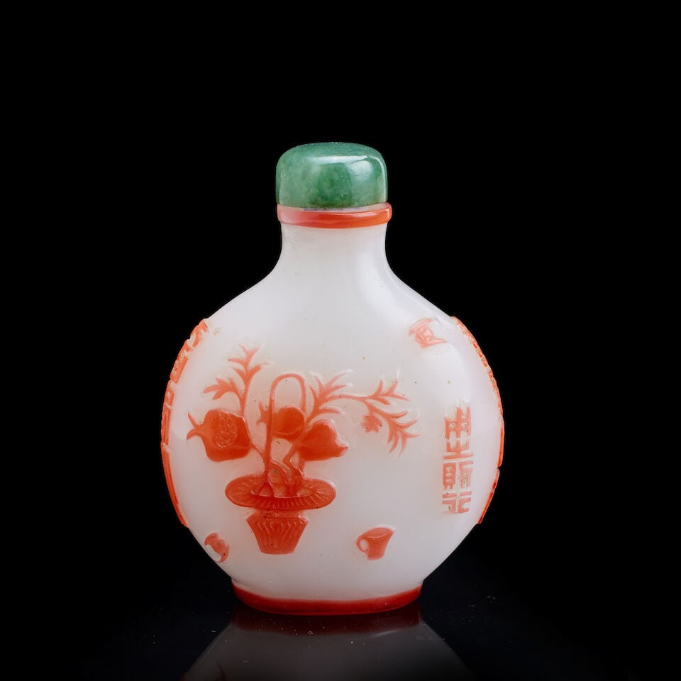A Chinese red-overlay glass 'bats, pomegranate and peaches' snuff bottle Yangzhou School, late Q... (1 of 3)