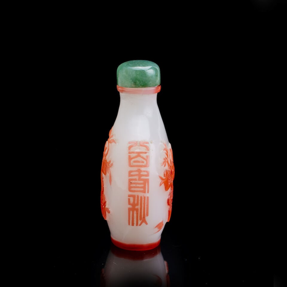 A Chinese red-overlay glass 'bats, pomegranate and peaches' snuff bottle Yangzhou School, late Q... - 2