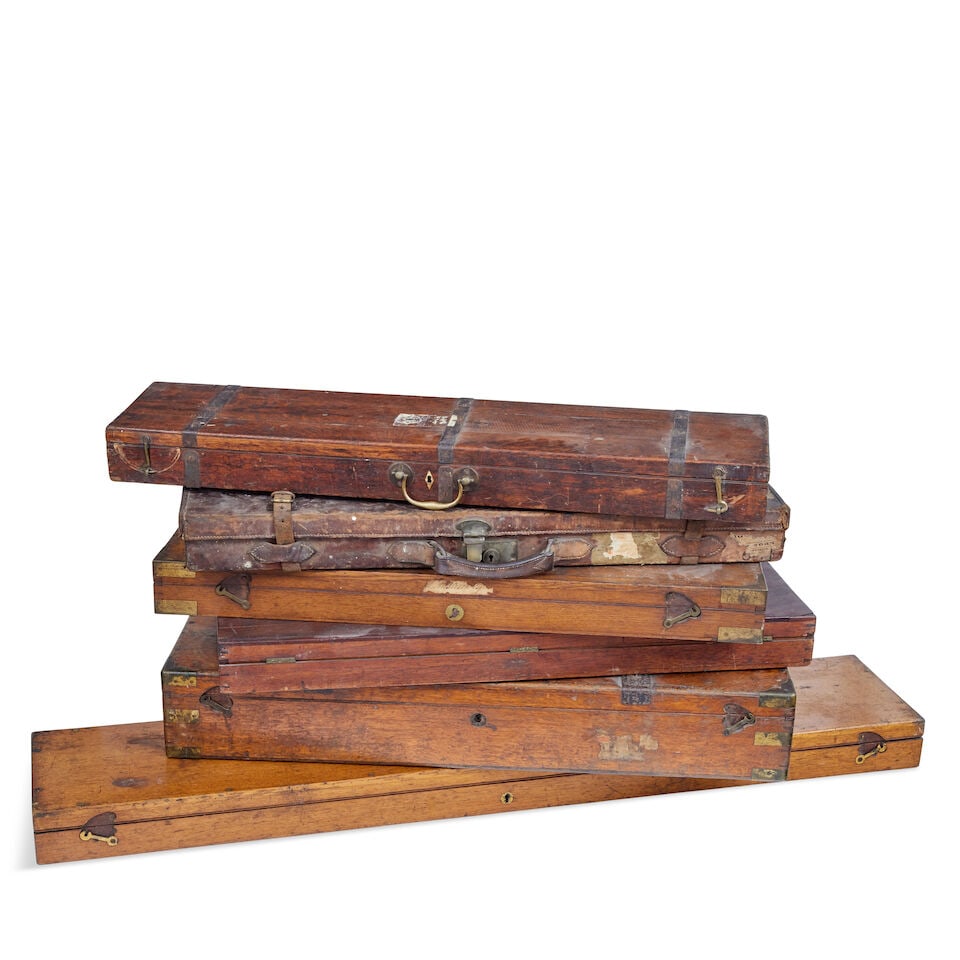 A group of six various 19th and 20th century shotgun and rifle cases with trade label for Boss, ...: A group of six various 19th and 20th century shotgun and rifle cases with trade label for Boss, Whitworth and Purdey Comprising a leather covered shot gun case lined in red baize, an oak double gun