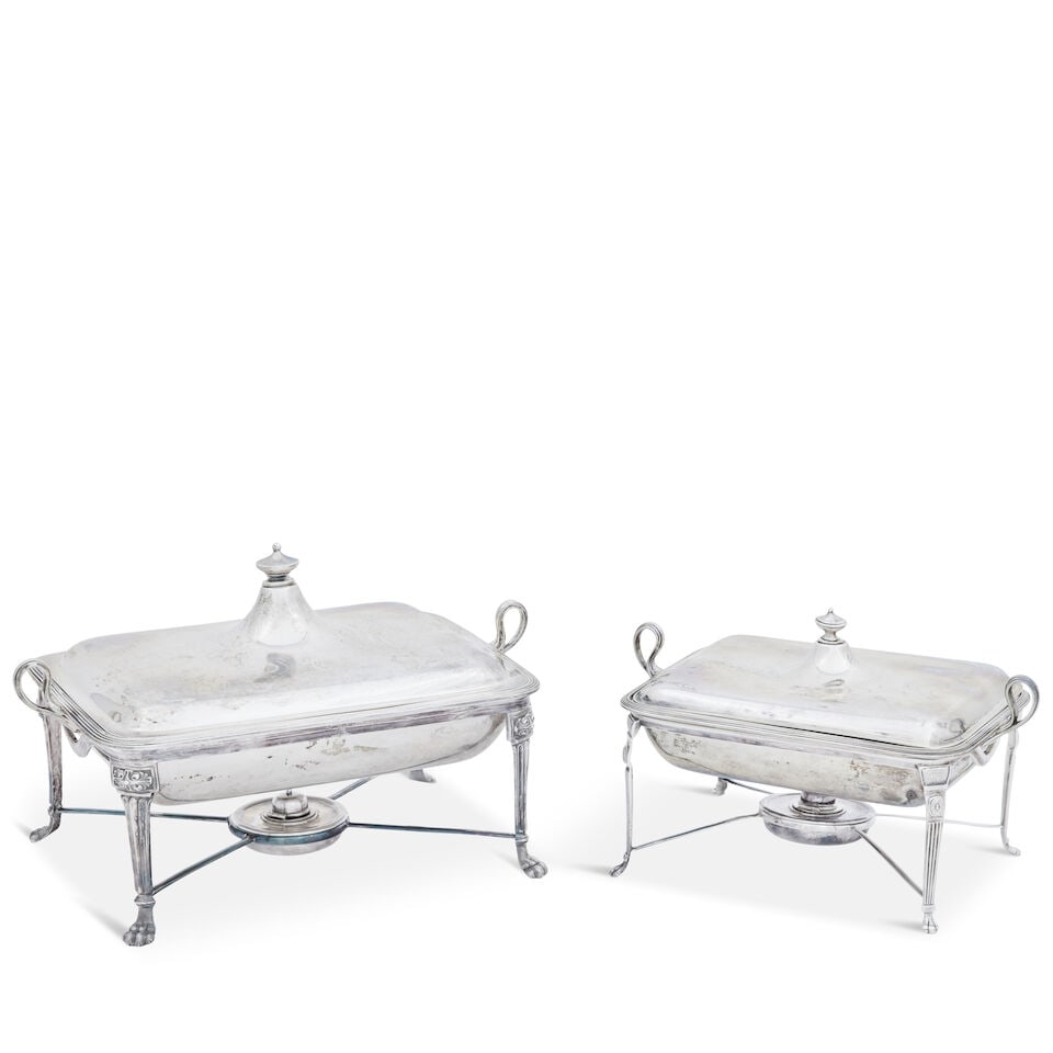 A graduated pair of silver entrée dishes with stands and burners Thomas Bradbury, London 18...: A graduated pair of silver entrée dishes with stands and burners Thomas Bradbury, London 1894 Of rectangular form, the dishes with urn-shaped knop handles, reeded borders and engraved crests, the