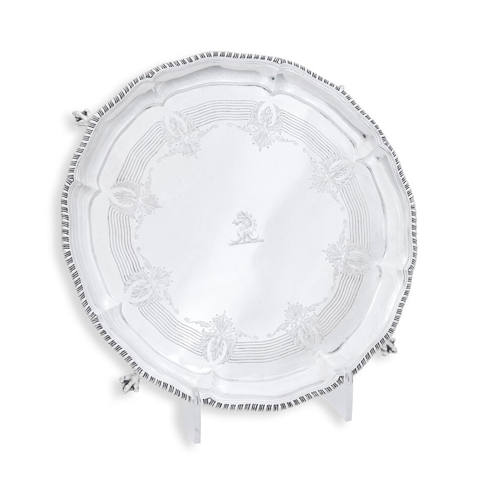 A Victorian silver salver By Walter & John Barnard, London, 1894: A Victorian silver salver By Walter & John Barnard, London, 1894 On four ball and claw feet, engraved to the centre with a crest within a band of foliate engraving and with gadrooned rim, diameter 30c