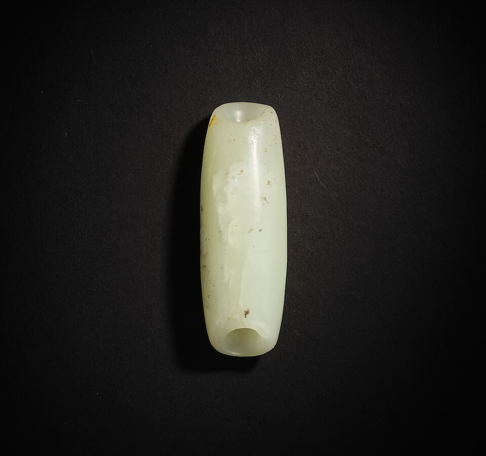 A JADE BEAD Neolithic Period: A JADE BEAD Neolithic Period 6.5cm long Footnotes: 新石器時代　玉管 For further information on this lot please visit Bonhams.com For further