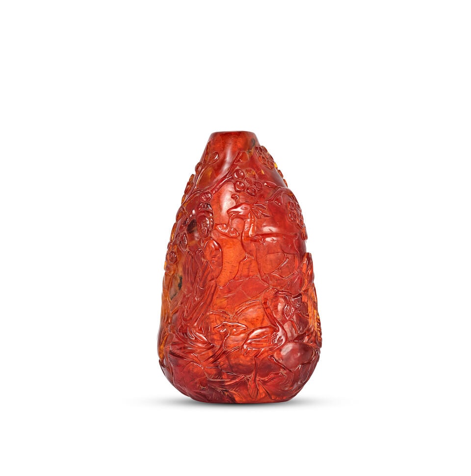 A CARVED AMBER 'IMMORTALITY' SNUFF BOTTLE Qing Dynasty, 18th/19th century - 2
