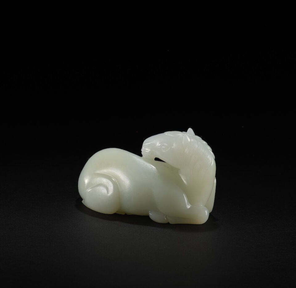 A WHITE JADE CARVING OF A HORSE Qing Dynasty, 18th/19th century - 2