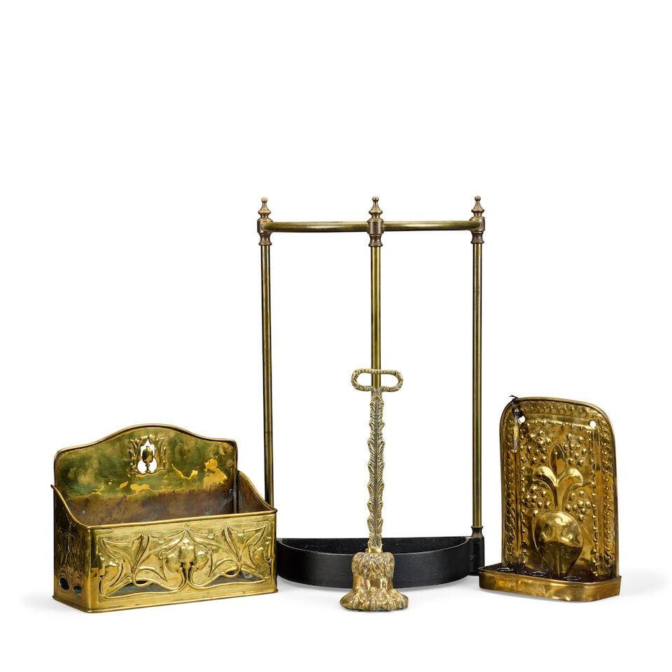 A pressed brass wall mounted candle sconce, together with a Victorian pressed brass wall mounted... (1 of 2)