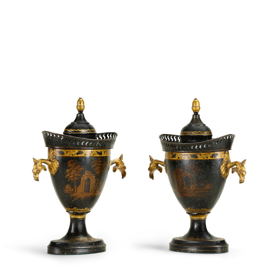 A pair of Regency black and gilt decorated toleware chestnut urns and covers Early 19th century ... - 2