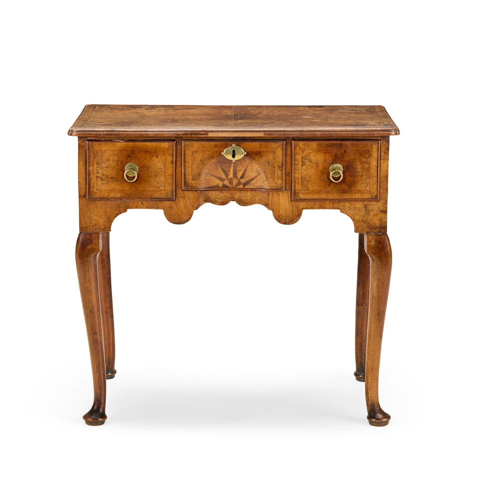 A George I walnut, crossbanded, featherbanded and fruitwood inlaid lowboyEnd of the first quarte... (1 of 6)
