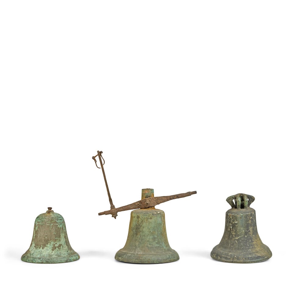 A collection of three bronze bells together with an early 20th century sundial The bells probab... - 2