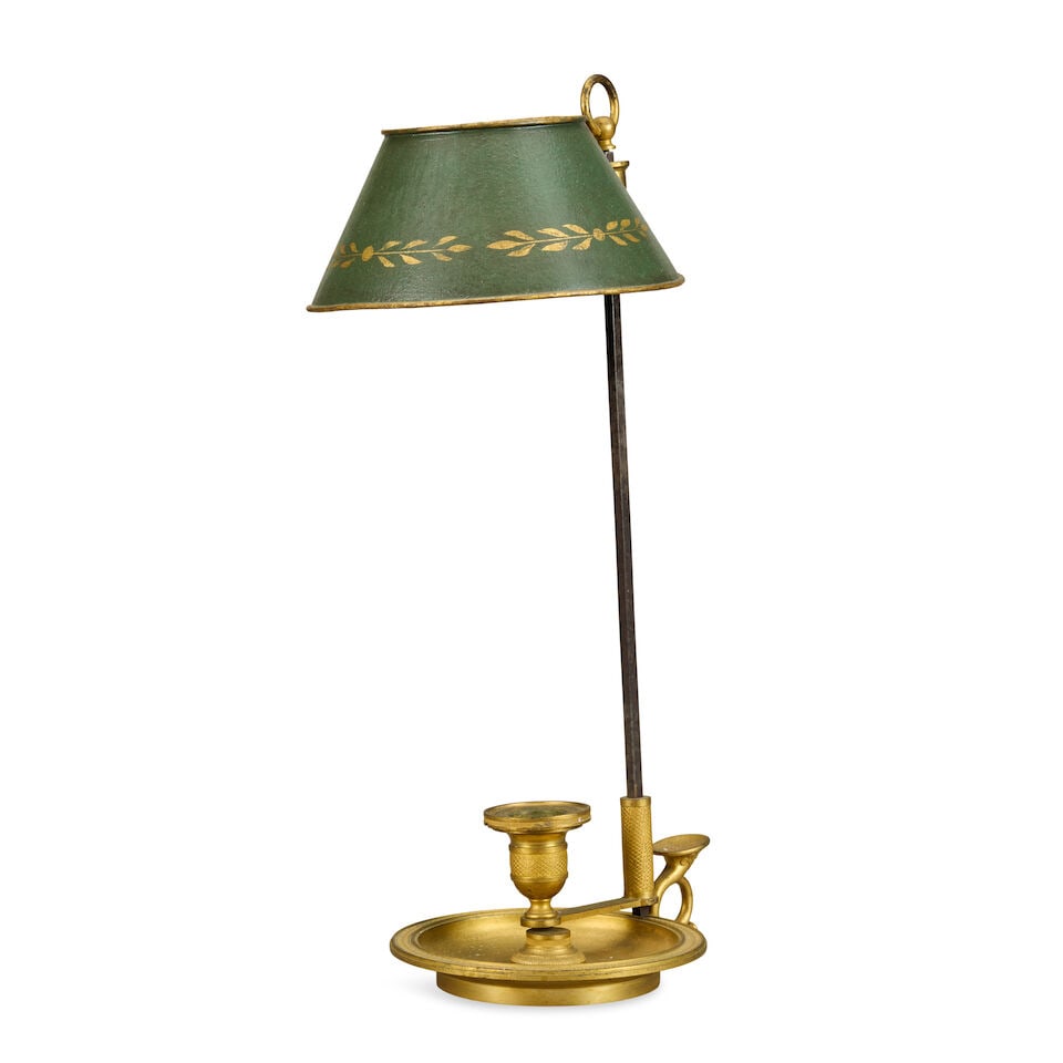 A French Empire ormolu one-light bouillotte lamp Early 19th century: A French Empire ormolu one-light bouillotte lamp Early 19th century With a green tôle peinte shade, and adjustable candle sconce with a hunting horn shaped cast thumb handle, 19cm wide, 16cm deep