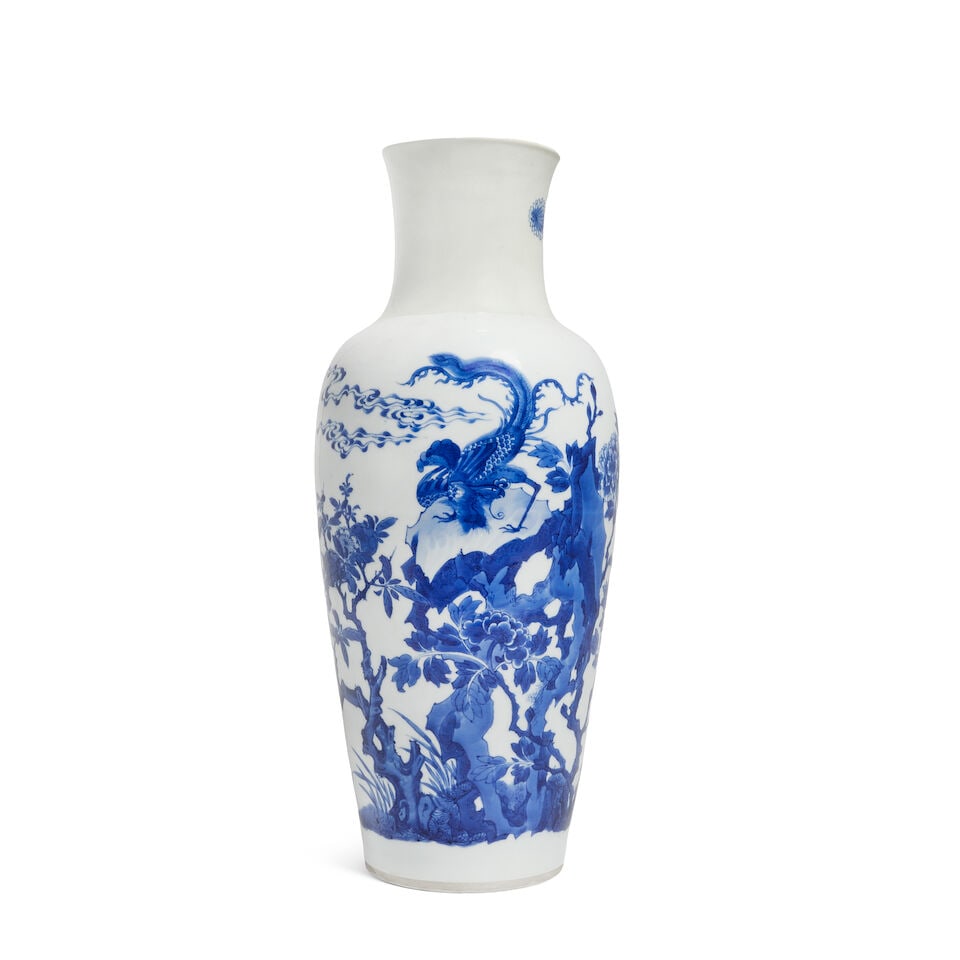 A Chinese blue and white vase Kangxi six-character mark: A Chinese blue and white vase Kangxi six-character mark Of tapering ovoid form, with all-over decoration of a dragon in a landscape, 41.5cm (16 1/4in) high For further information on this lot please v