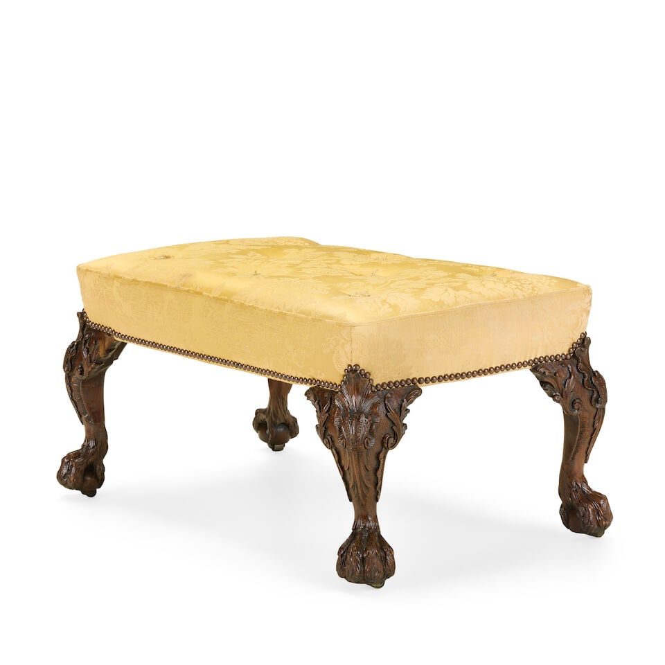 A carved mahogany stool in the manner of Giles GrendeyLate 19th / early 20th century in the Geor...: A carved mahogany stool in the manner of Giles Grendey Late 19th / early 20th century in the George II style The stuff-over seat above acanthus leaf carved cabriole legs and hairy-paw feet with sunken