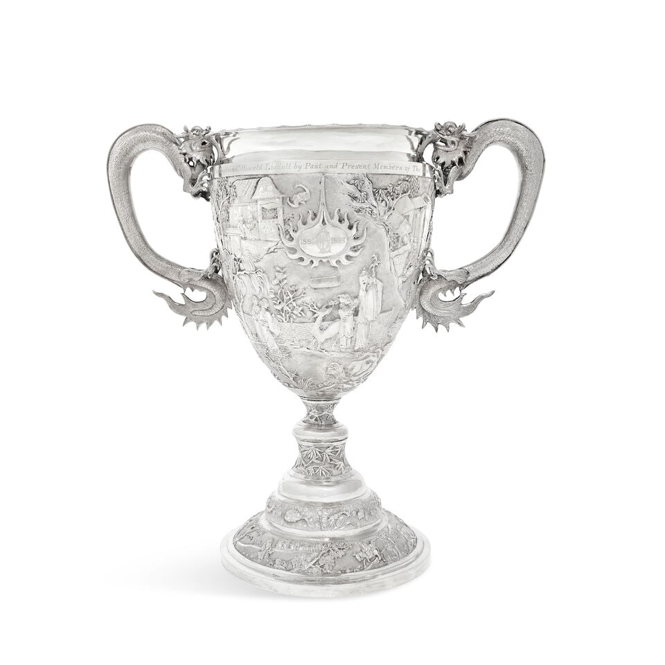A Chinese late 19th century export silver twin-handle trophy Wenwo, Shanghai: A Chinese late 19th century export silver twin-handle trophy Wenwo, Shanghai The twin handles modelled as dragons, with presentation engraving 'Presented to Captain C. Oswald Liddell by Past and Prese
