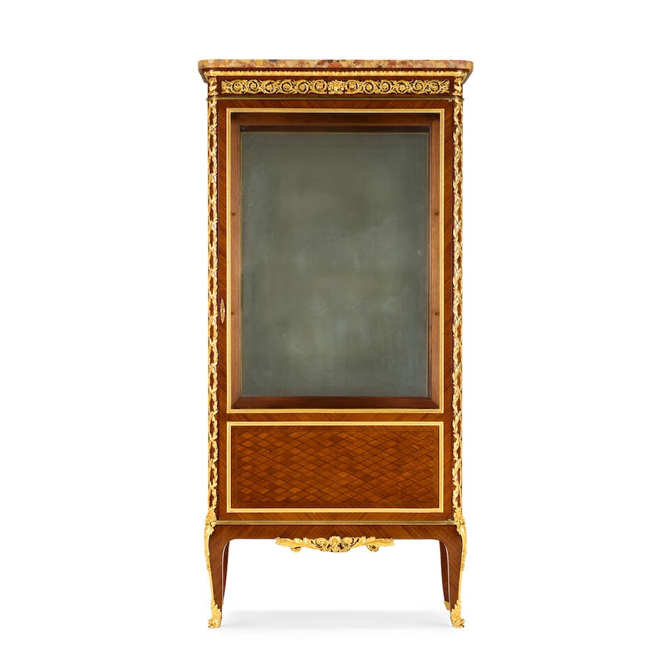 A French kingwood, parquetry and gilt bronze mounted vitrine in the Louis XVI styleLate 19th / e...: A French kingwood, parquetry and gilt bronze mounted vitrine in the Louis XVI style Late 19th / early 20th century, retailed by Maison Boudet The brèche d'Alep marble top above an egg and dart mo