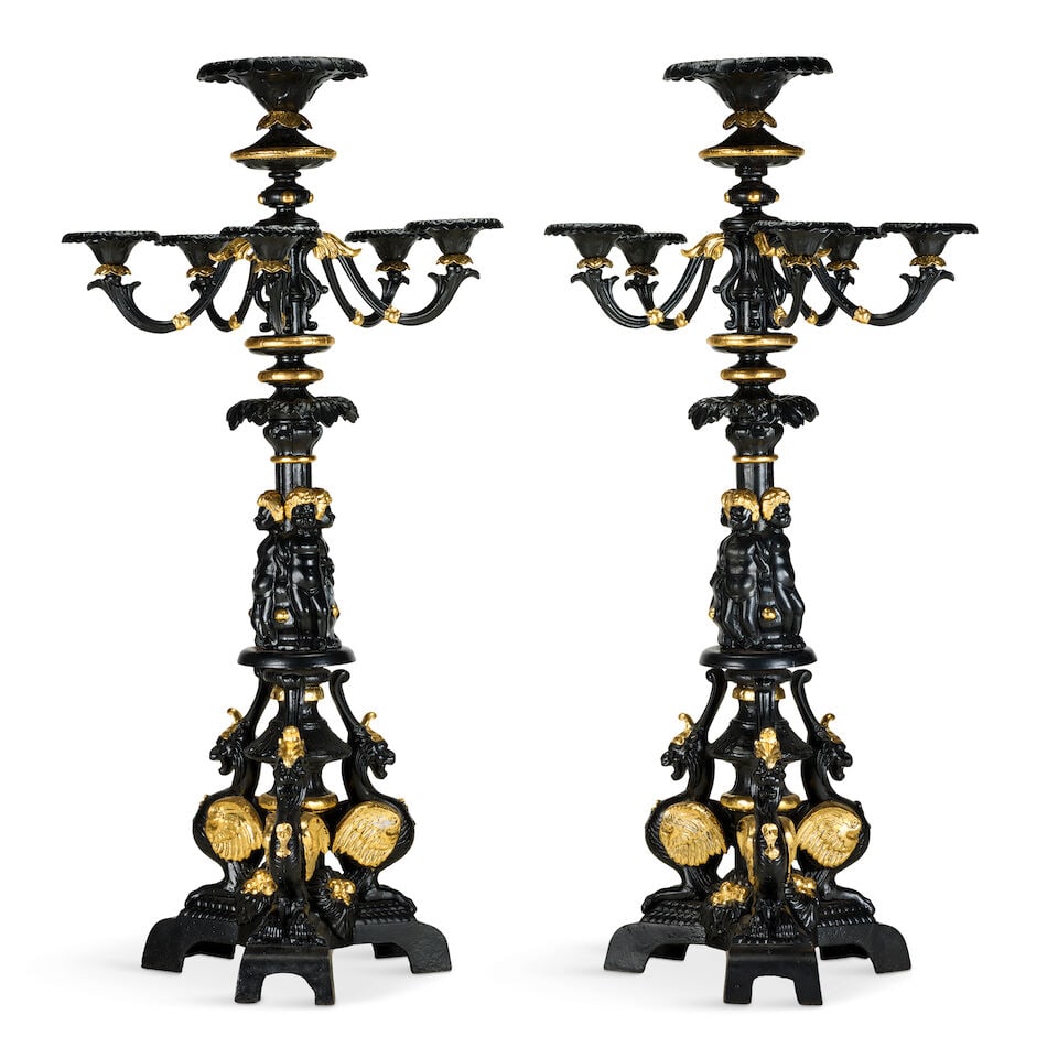 A large pair of painted and parcel gilt cast iron five branch candelabra20th century in the mid-...: A large pair of painted and parcel gilt cast iron five branch candelabra 20th century in the mid-19th century style and in the manner of Coalbrookdale The central oversized candle sconce enclosed by