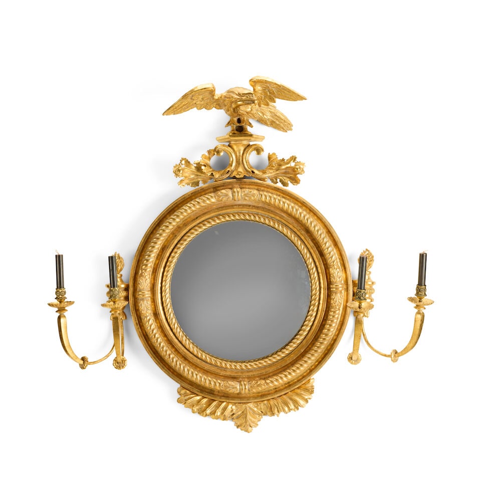 A large carved giltwood and composition convex girandoleEarly 19th century and later (1 of 2)