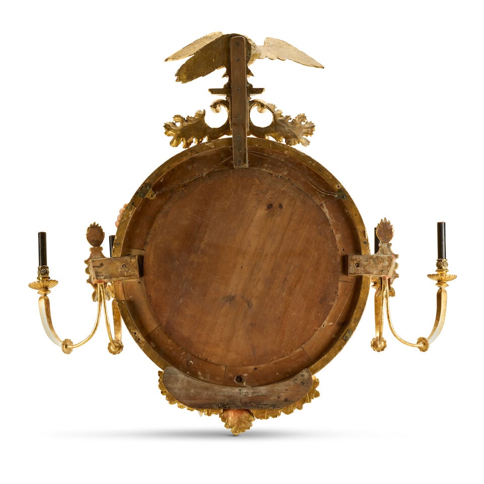 A large carved giltwood and composition convex girandoleEarly 19th century and later - 2