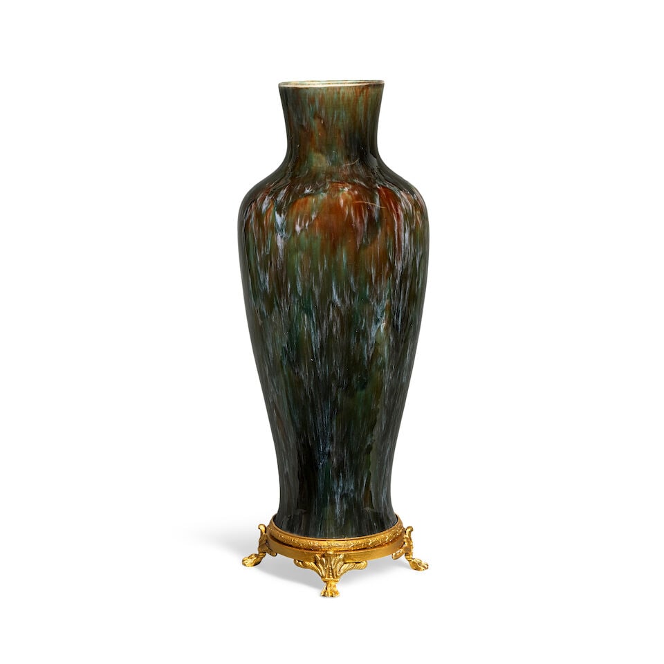 A gilt bronze mounted Chinese flambé glaze porcelain vase The porcelain 19th/20th century: A gilt bronze mounted Chinese flambé glaze porcelain vase The porcelain 19th/20th century Of baluster form, 18cm wide, 18cm deep, 50cm high (7in wide, 7in deep, 19 1/2in high) For further informa