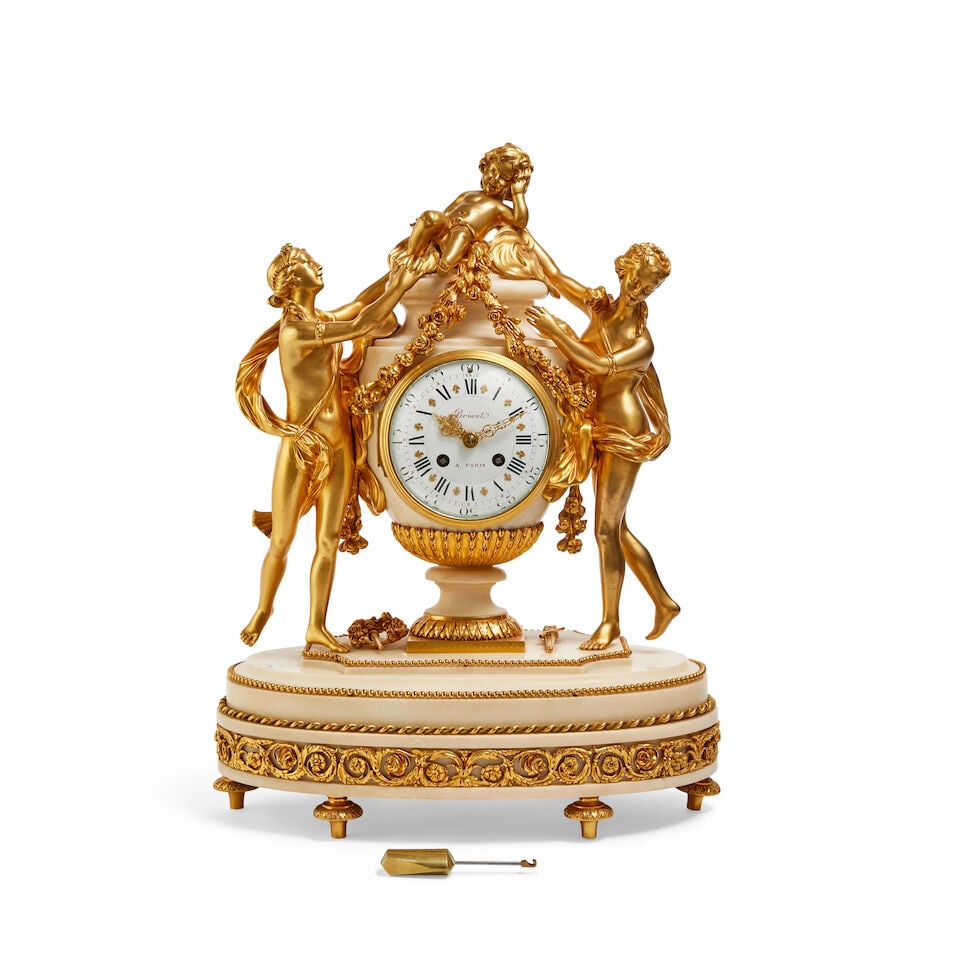 A French 19th century gilt bronze and marble mantel clock Briant, Paris: A French 19th century gilt bronze and marble mantel clock Briant, Paris The central marble urn surmounted by a child and flanked by two classically draped female figures on a stepped base, the white e