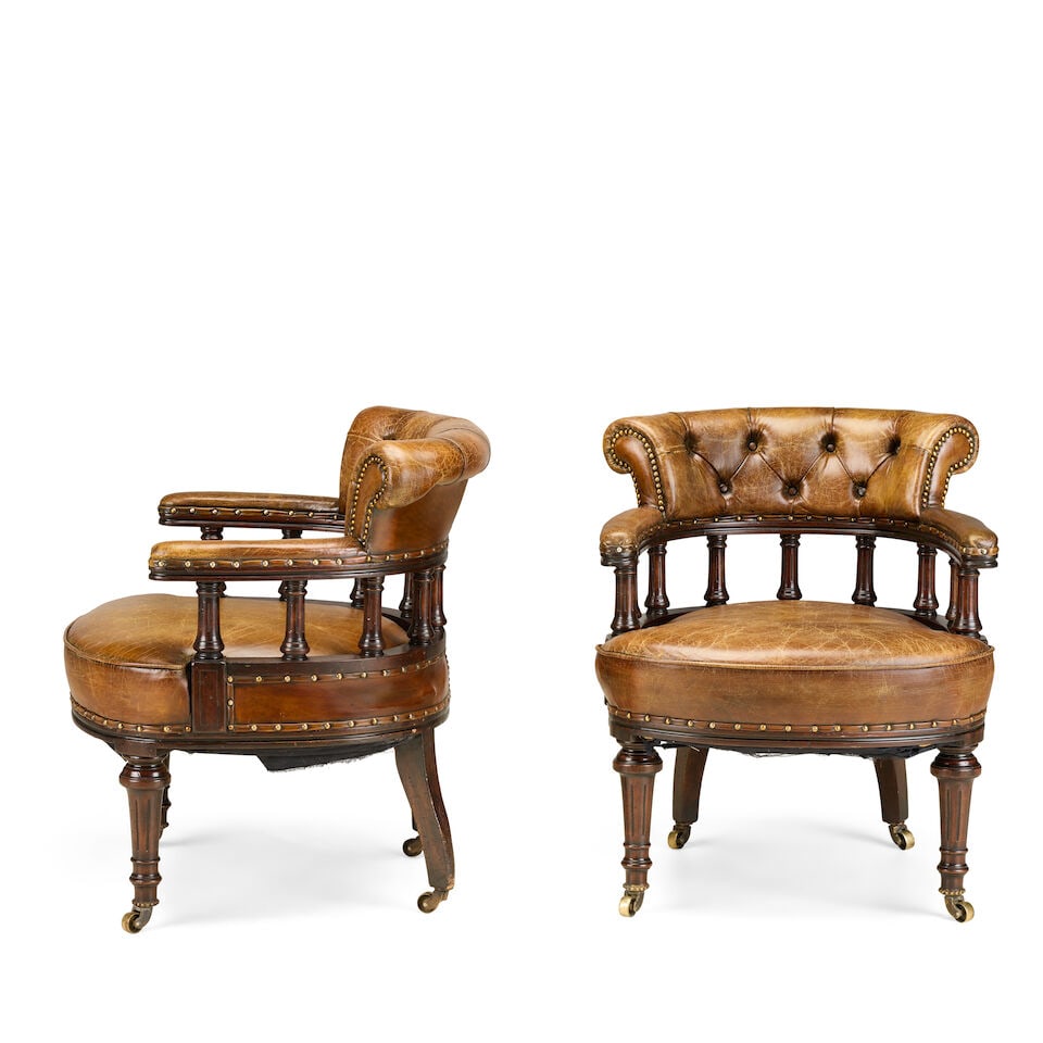 A pair of Victorian style mahogany and leather upholstered library armchairs Second half 20th ce... - 2