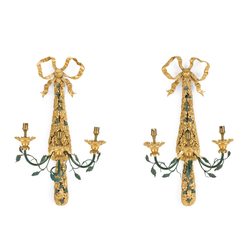 A pair of French tôle gilt and painted three branch wall lights First half 20th century (2): A pair of French tôle gilt and painted three branch wall lights First half 20th century The back plates modelled as ribbon tied trailing oak leaves and acorns issuing three scrolling candle arms,