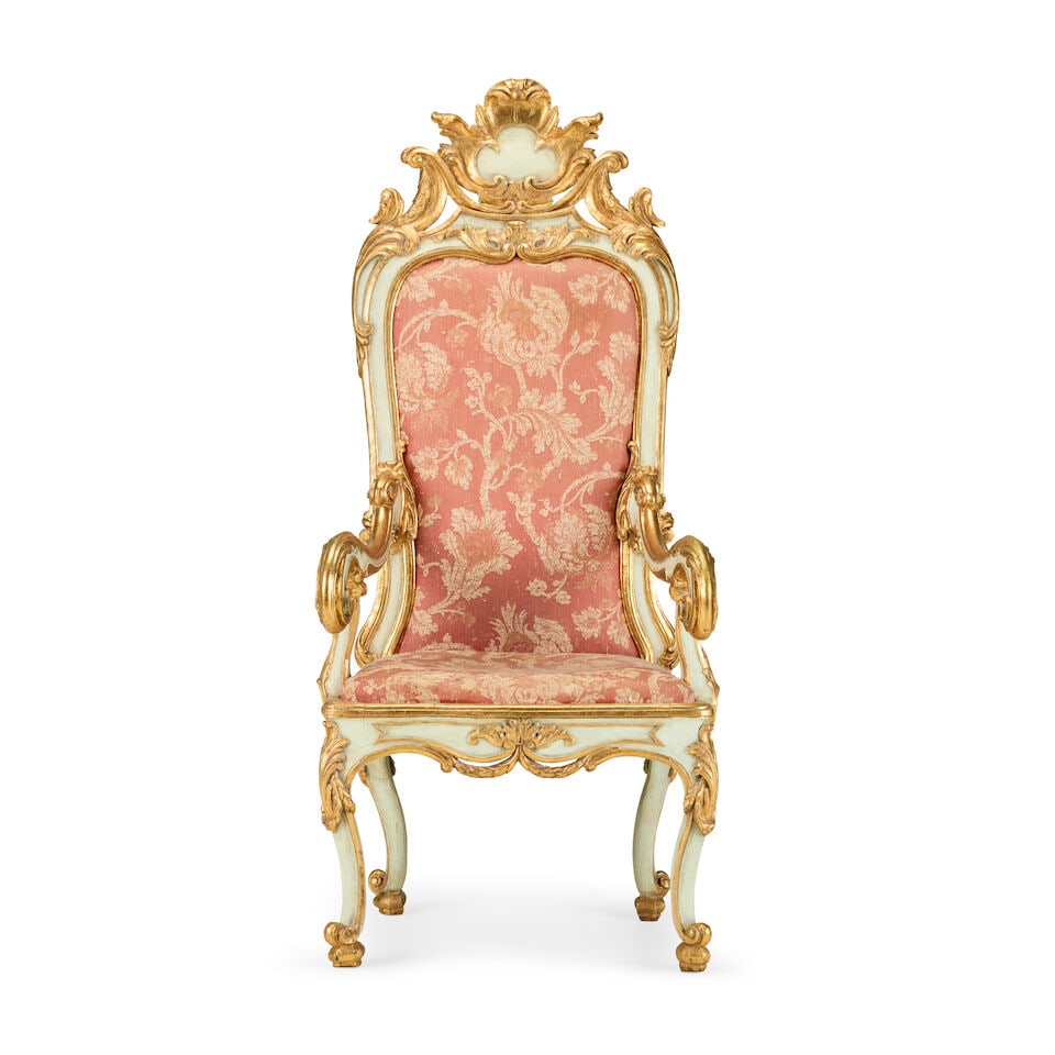 A North Italian painted and parcel gilt armchair19th century, Venetian in the Rococo style: A North Italian painted and parcel gilt armchair 19th century, Venetian in the Rococo style Of large proportions, the upholstered detachable back surmounted by a scrolling acanthus leaf and cartouche