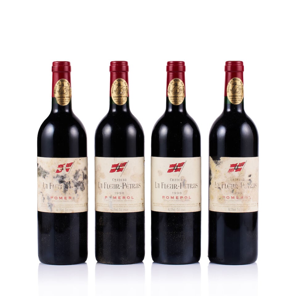 Château La Fleur-Pétrus, Pomerol, 1998 (4 x 750ml): Château La Fleur-Pétrus, Pomerol, 1998 (4 x 750ml) Region: Bordeaux Fill Level: into neck Capsule: ok Cork: 4x slightly depressed Label: all torn, stained, damp-stained and marked, 1x illegi