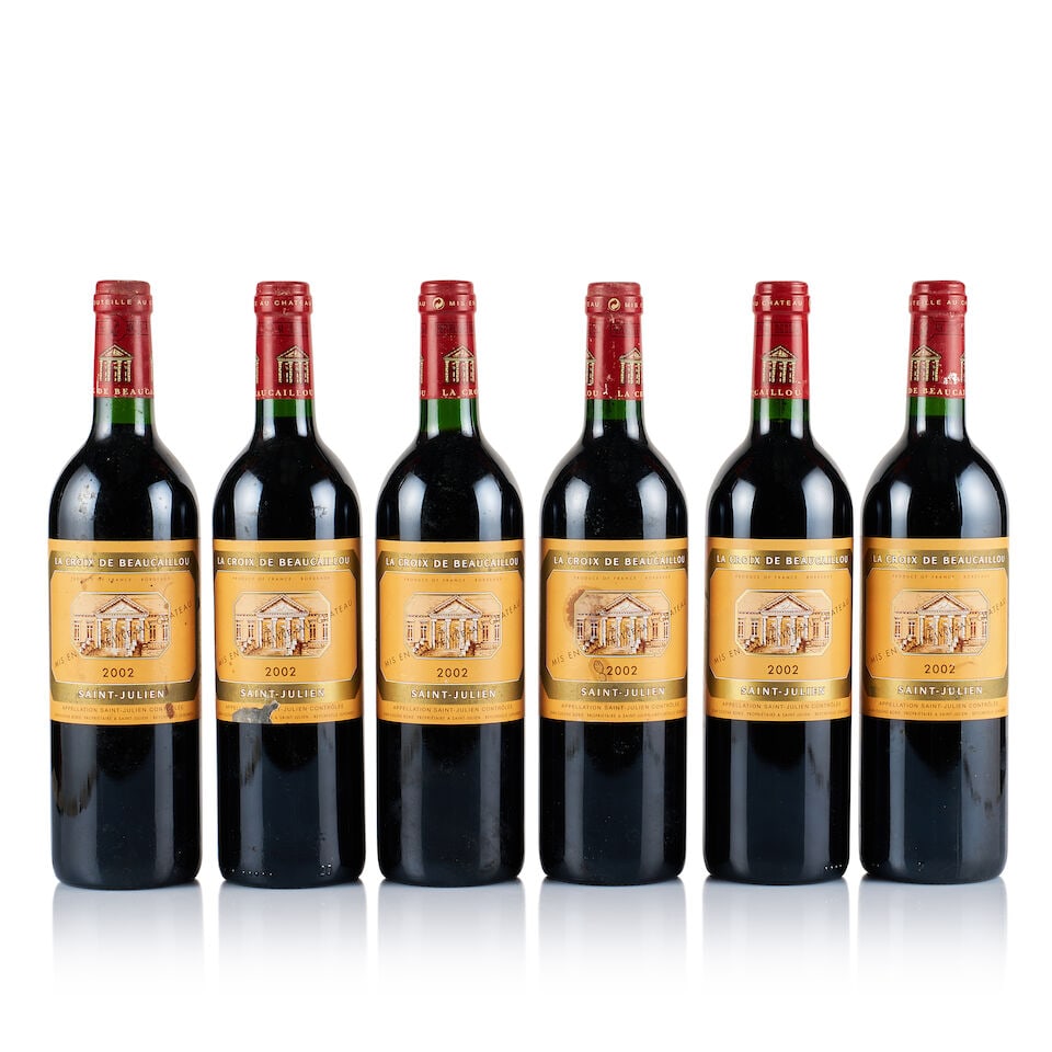 Château Ducru-Beaucaillou, Saint-Julien, La Croix de Beaucaillou, 2002 (6 x 750ml): Château Ducru-Beaucaillou, Saint-Julien, La Croix de Beaucaillou, 2002 (6 x 750ml) Region: Bordeaux Fill Level: into neck Capsule: ok Cork: ok Label: all covered with dust and slightly stained, 1