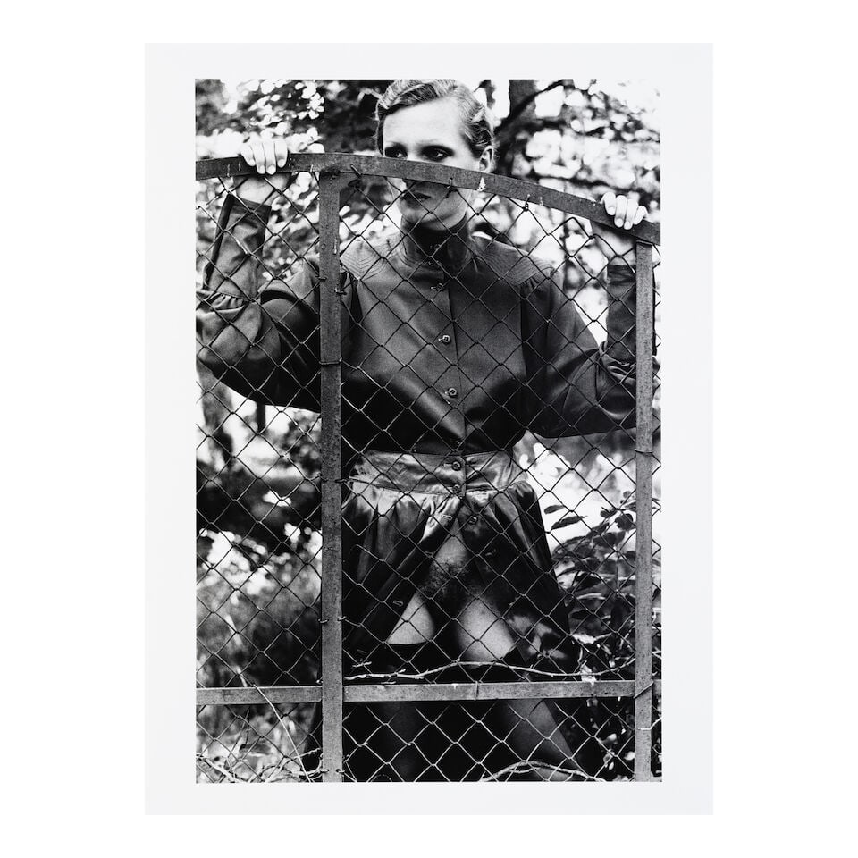 Helmut Newton (1920-2004); Roselyne Behind Fence, Arcangues, France (from 'Private Property'); - 2