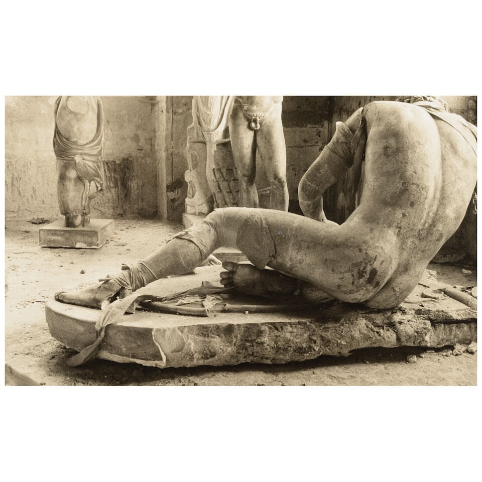 Deborah Turbeville (1932-2013); Sculpture Storeroom (from 'Unseen Versailles');: Deborah Turbeville (1932-2013) Sculpture Storeroom (from 'Unseen Versailles'), 1990 Sepia-toned gelatin silver print; the photographer's estate stamp on the reverse; accompanied by a Certificate of