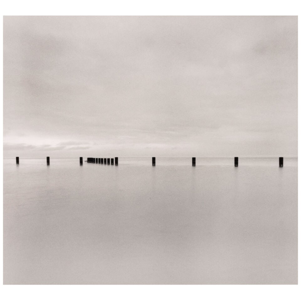 Michael Kenna (born 1953); 'Line of Posts, Chicago, Illinois, USA';: Michael Kenna (born 1953) 'Line of Posts, Chicago, Illinois, USA', 2001 Sepia-toned gelatin silver print; mounted, signed, dated, and editioned '7/45' in pencil on the mount, the photographer's copyri