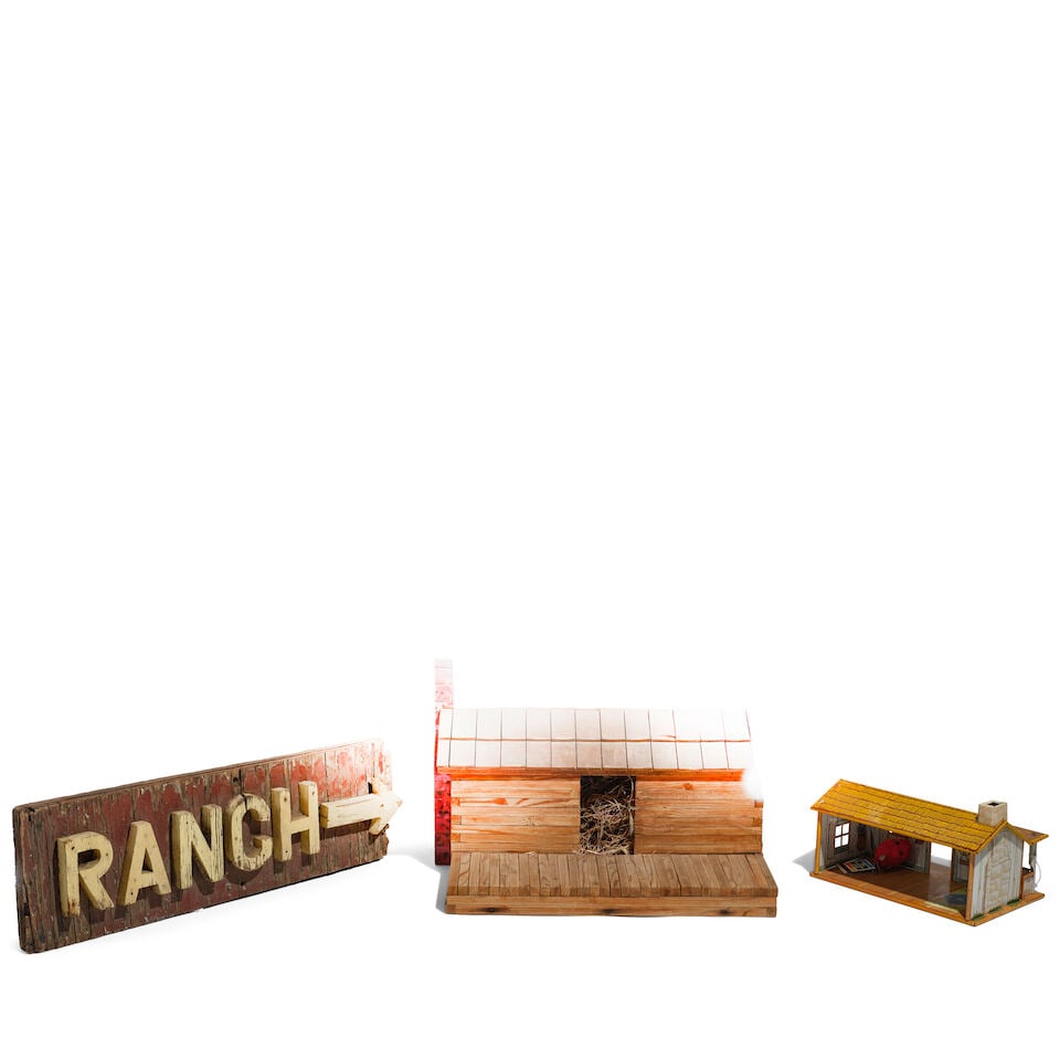 A CURATED SELECTION OF RUSTIC DWELLING THEMED DECORATIONS: A CURATED SELECTION OF RUSTIC DWELLING THEMED DECORATIONS Comprising a wood model of a cabin filled with straw and dried grasses, a polychrome tin cabin dollhouse, a framed Ansel Adams reproduction ph