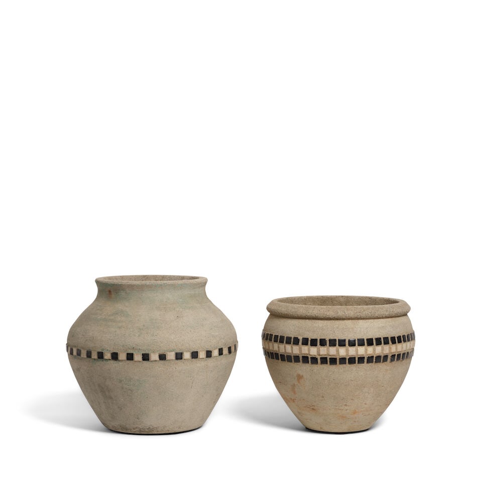 TWO CALIFORNIA HILLSIDE POTTERY BLACK AND WHITE TILE INSET CEMENT VASESLos Angeles, 20th century: TWO CALIFORNIA HILLSIDE POTTERY BLACK AND WHITE TILE INSET CEMENT VASES Los Angeles, 20th century height of taller 11 1/2in; diameter 8in Footnotes: From Diane Keaton's living room in her Sullivan