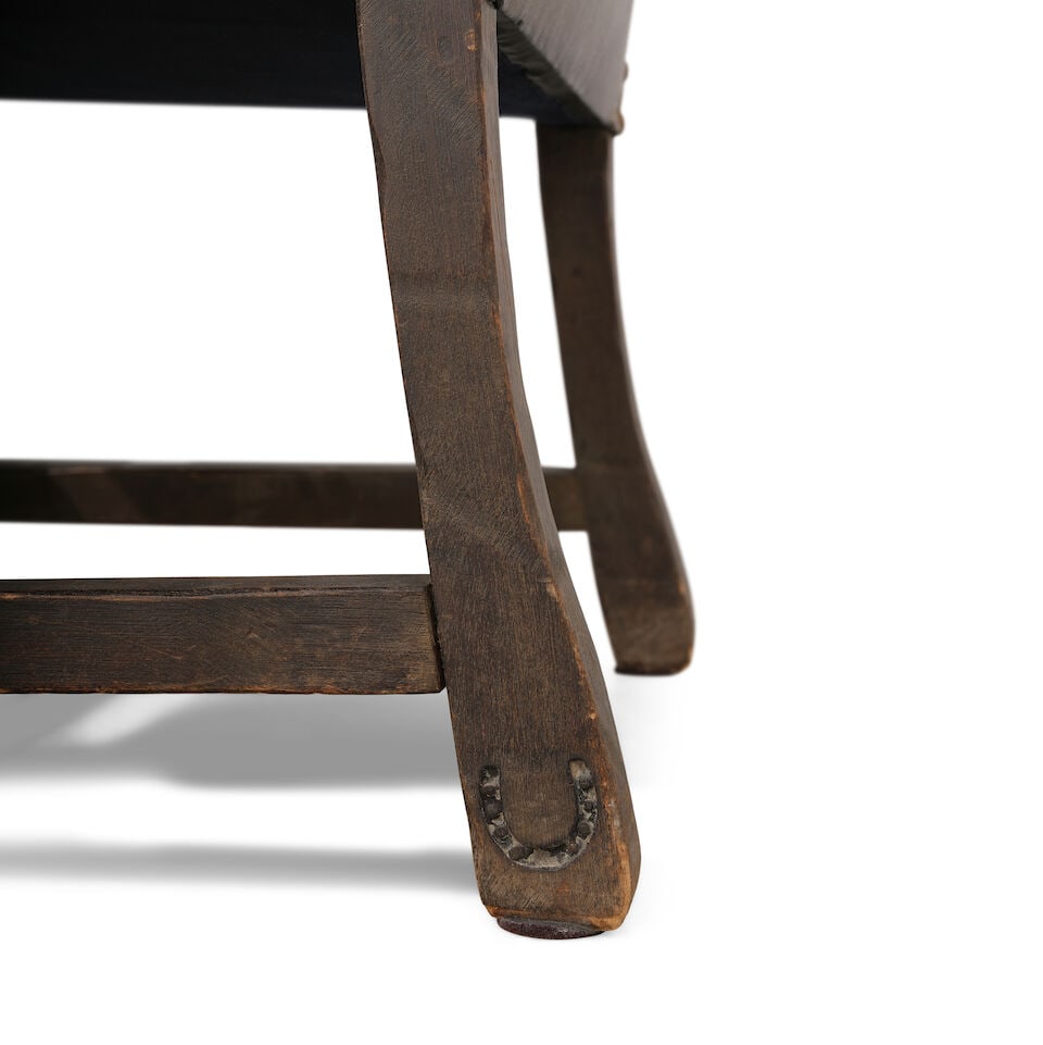 A MONTEREY IRON MOUNTED OLD WOOD STAINED LEATHER UPHOLSTERED ARMCHAIRCirca 1930 - 2