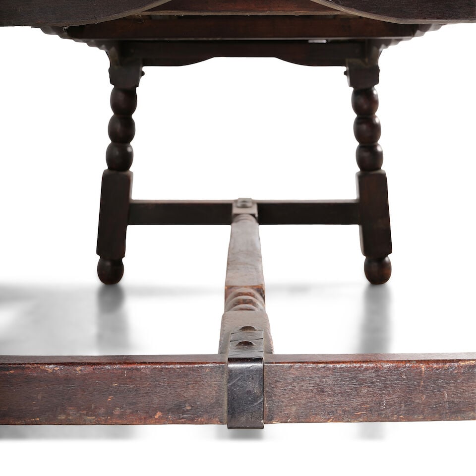 A MONTEREY IRON MOUNTED OLD WOOD STAINED EXTENSION DINING TABLECirca 1930 - 2