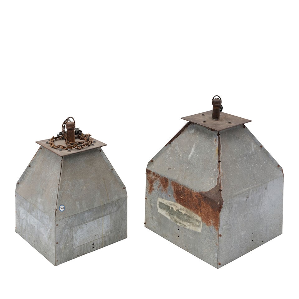 TWO INDUSTRIAL METAL CHICKEN FEEDER PENDANT LAMPSHADES20th century: TWO INDUSTRIAL METAL CHICKEN FEEDER PENDANT LAMPSHADES 20th century height of larger 33in; width 22 1/4in square; height of smaller 29in; width 18 1/4in square Footnotes: These are similar to the ligh