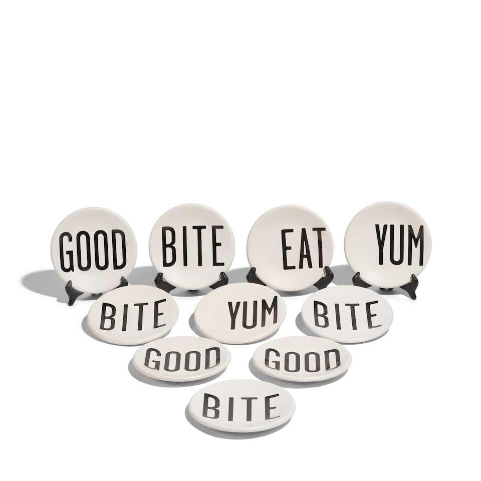 TEN K BY KEATON WHITE CERAMIC BREAD AND BUTTER PLATES: TEN K BY KEATON WHITE CERAMIC BREAD AND BUTTER PLATES Comprising four BITE examples, three GOOD examples, two YUM examples, and one EAT example. diameter 6 1/4in Footnotes: From Diane Keaton's