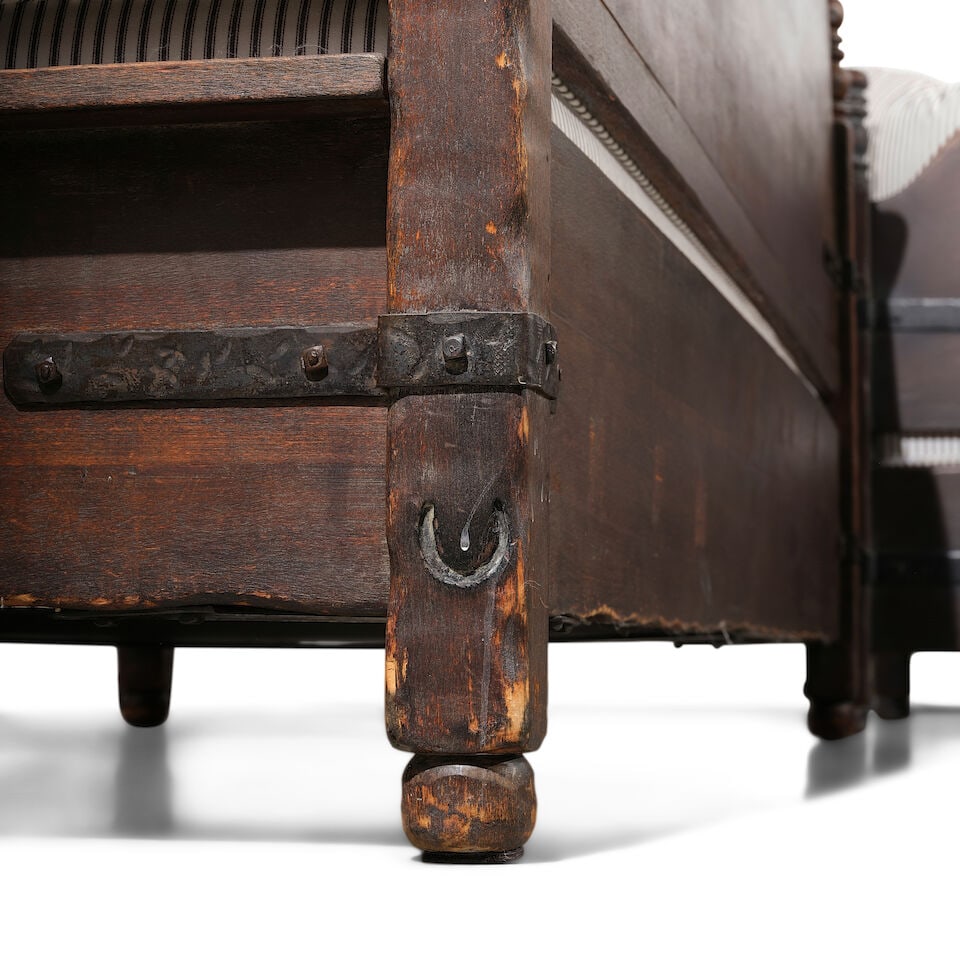 A MONTEREY IRON MOUNTED OLD WOOD STAINED SETTEECirca 1930 - 2
