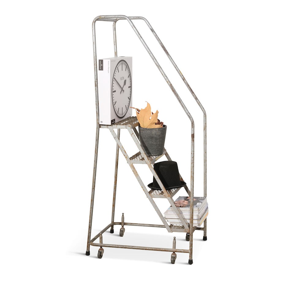 A CURATED METAL STEP LADDER CURATED WITH ICONIC BLACK TOP HAT AND DECORATIONS - 2