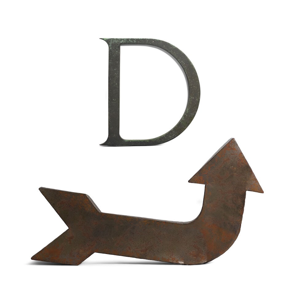 A METAL ARROW AND THE LETTER D: A METAL ARROW AND THE LETTER D height of arrow 33in; width 21in; depth 2in This lot is subject to the following lot symbols: ¤ ¤ Unless indicated by the ¤ symbol next to the lot number