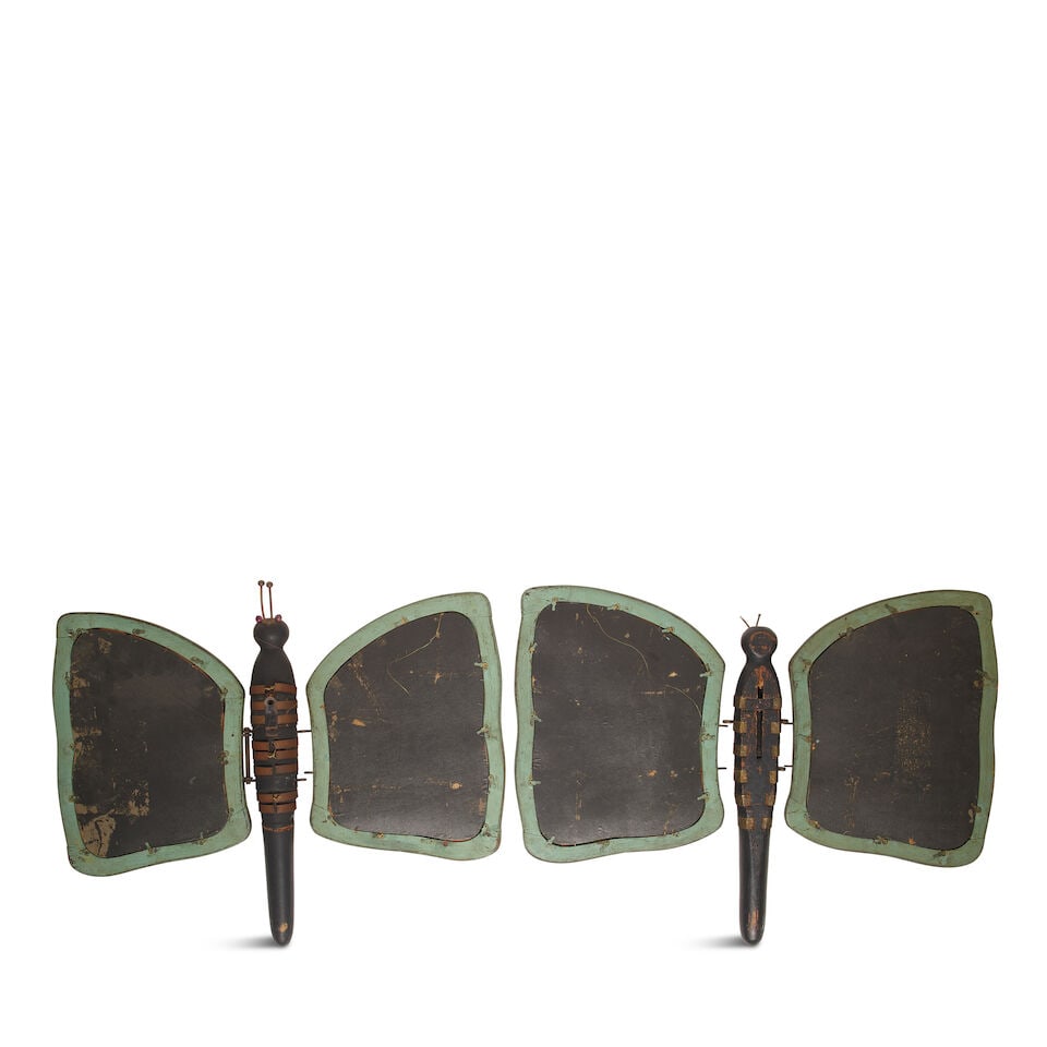 A PAIR OF RUSTIC METAL MOUNTED PAINTED WOOD BUTTERFLY-FORM HINGED MIRRORS20th century - 2