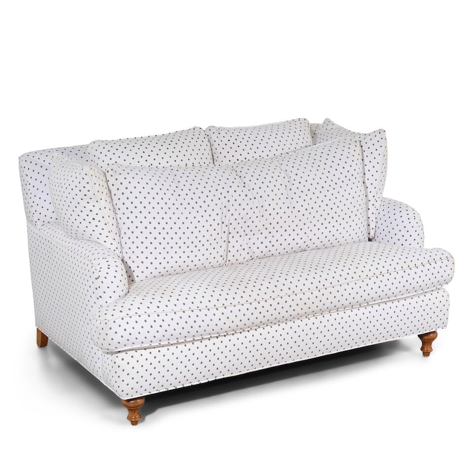 A POLKA DOT UPHOLSTERED LOVESEAT: A POLKA DOT UPHOLSTERED LOVESEAT height 34 1/2in; width 61in; depth 42in Footnotes: From Diane Keaton's guest bedroom in her Sullivan Canyon home. This lot is subject to the following lot symbols: W