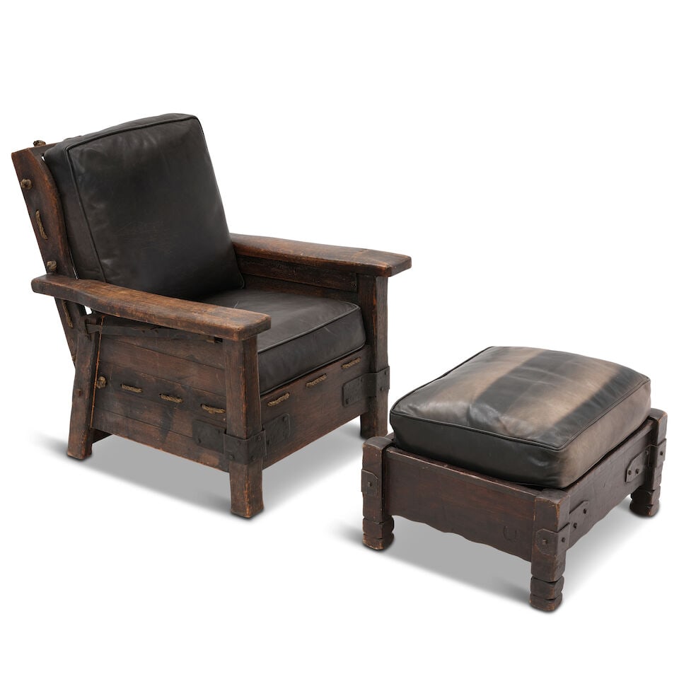 A MONTEREY STYLE IRON MOUNTED ROPE AND STAINED WOOD RECLINING CLUB CHAIR AND OTTOMAN: A MONTEREY STYLE IRON MOUNTED ROPE AND STAINED WOOD RECLINING CLUB CHAIR AND OTTOMAN With faux leather cushions and pillows. height of club chair 37 1/4in; width 32 1/2in; depth 35in; height of