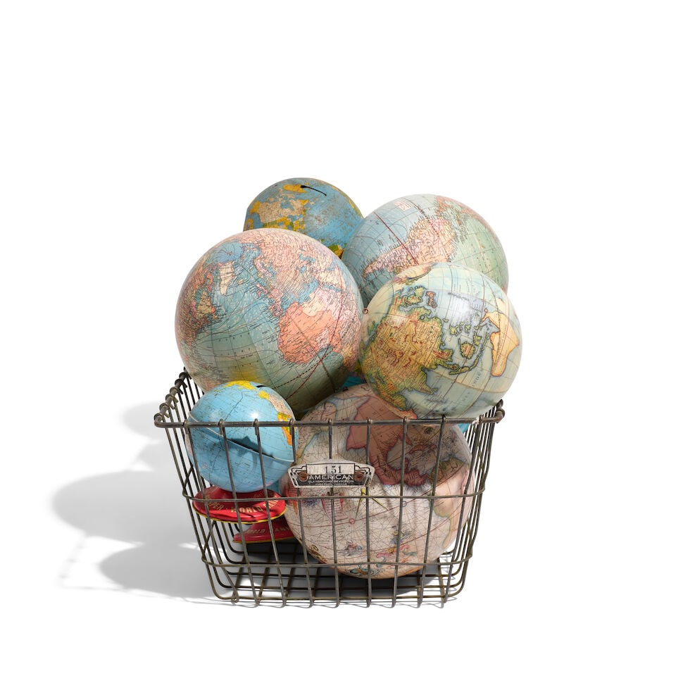 AN INDUSTRIAL WIRE BASKET FILLED WITH GLOBES (1 of 1)